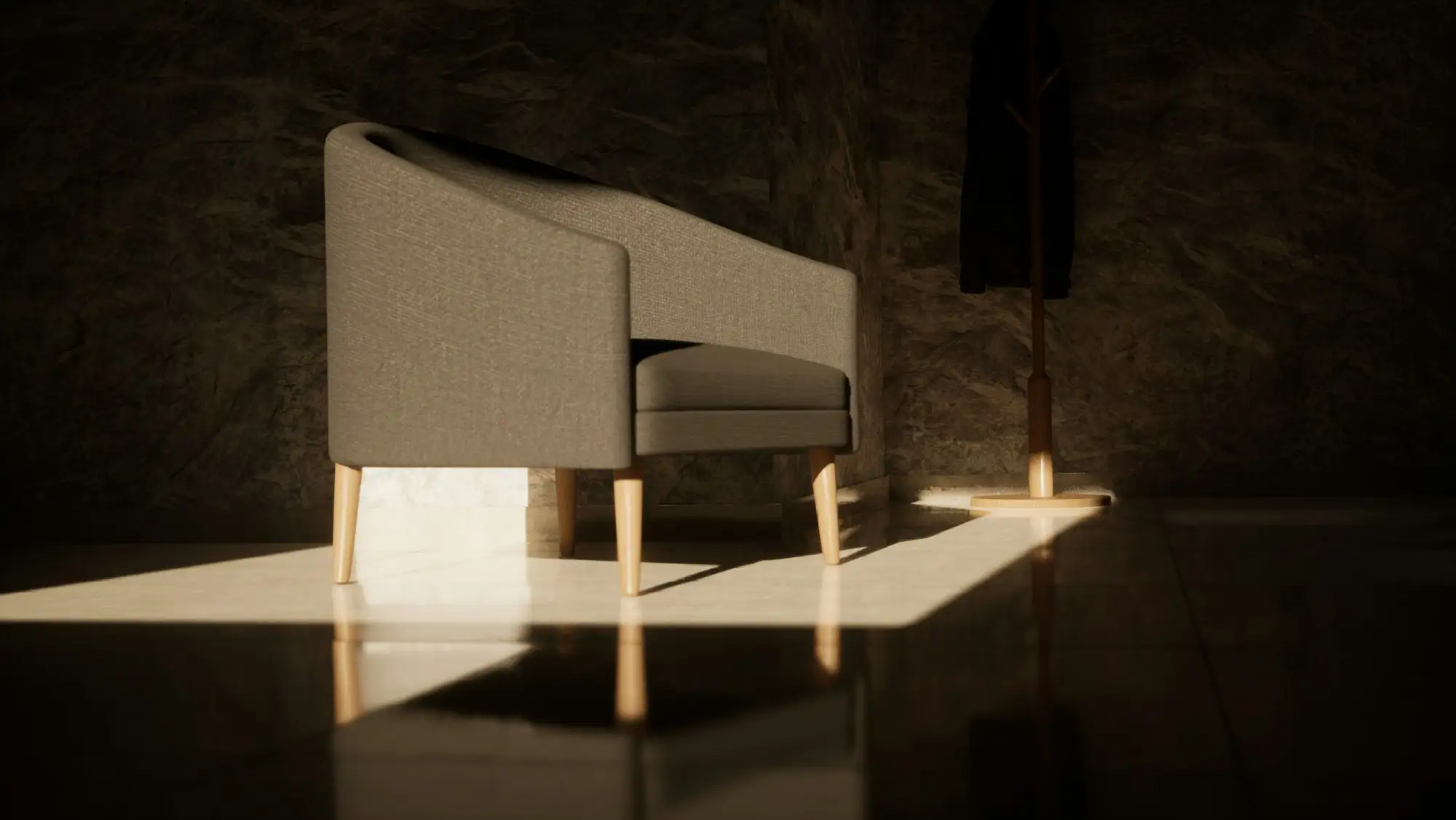 Sillón tapizado iluminado por una franja de luz rasante sobre piso brillante